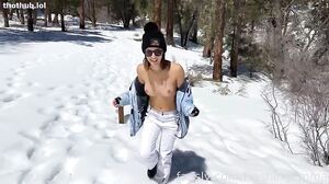 Busty Babe Flashes Her Assets in a Steamy Snowman Adventure