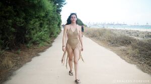 Naked Sally strolls through public streets in daring outdoor exhibition