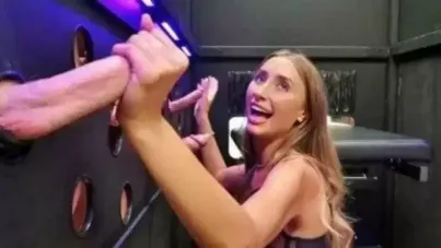 Lily Phillips Takes on a Gloryhole Gangbang with Massive Cumshots